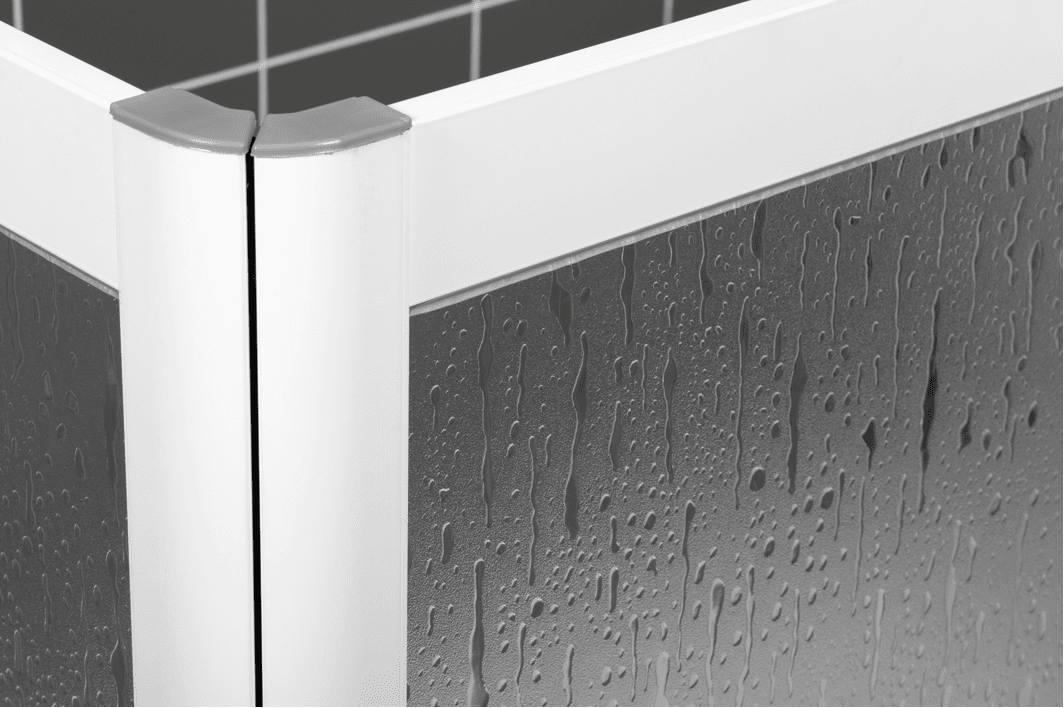 Close-up of textured shower screen panel with water droplets.