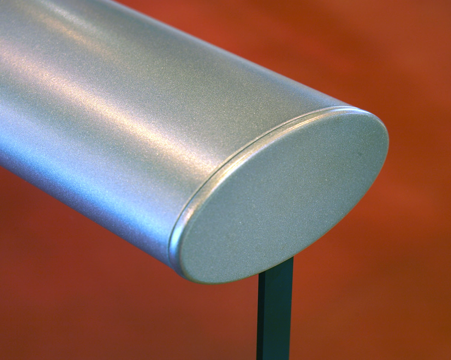 Close-up of a metallic Neaco handrail with a smooth aluminium finish.