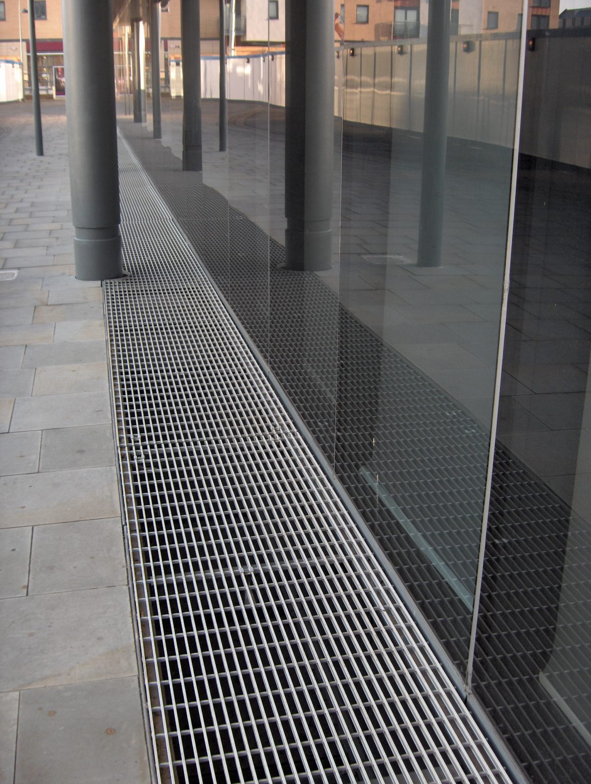 Ground-level ventilation grille made with NI Bar ribbed surface, providing non-slip qualities and high strength-to-weight ratio at Brewery Wharf, Leeds.