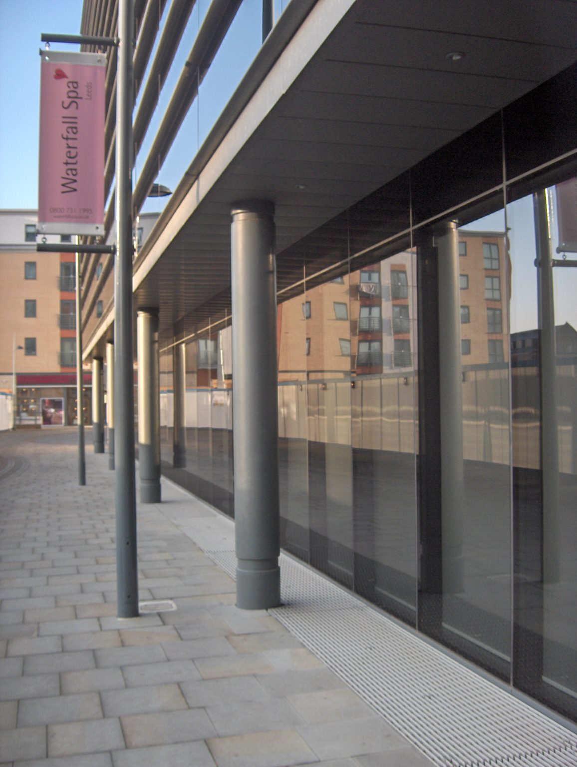Architectural ventilation grille spanning the front elevation of a main office building, made from NI Bar with a ribbed surface, Brewery Wharf, Leeds.